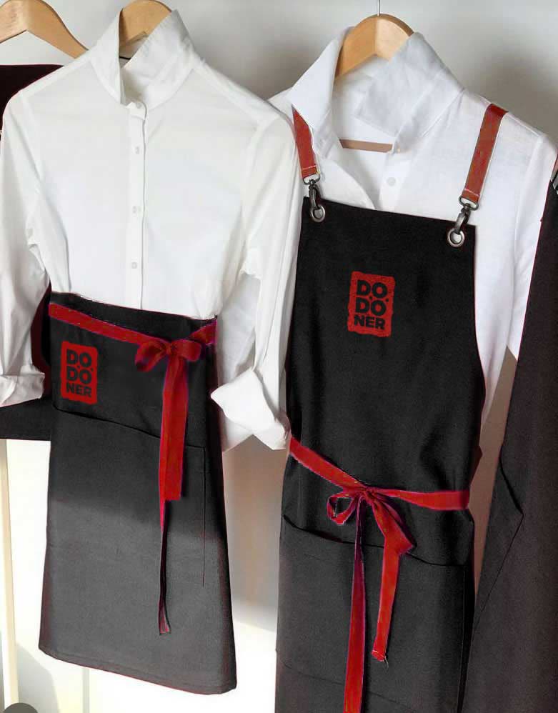 Dodoner aprons in red and black with the square mark