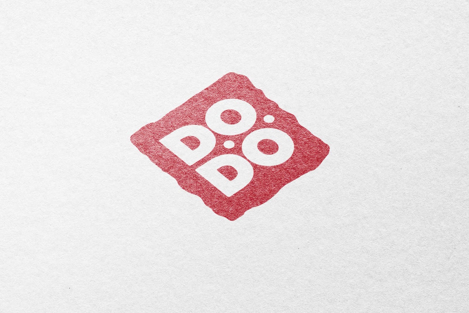 The Dodoner square mark pressed into white paper