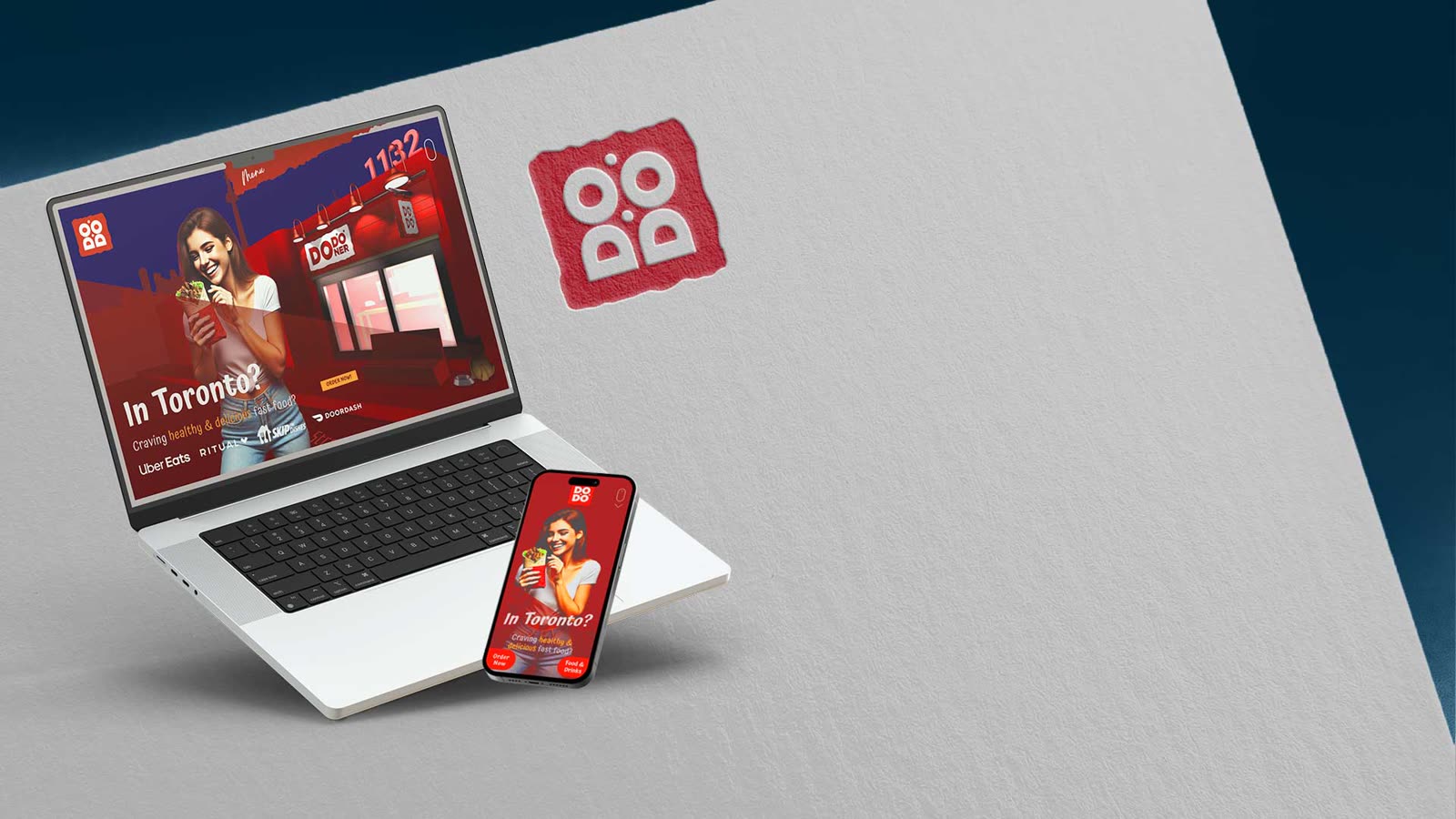 The Dodoner website on a laptop and a phone
