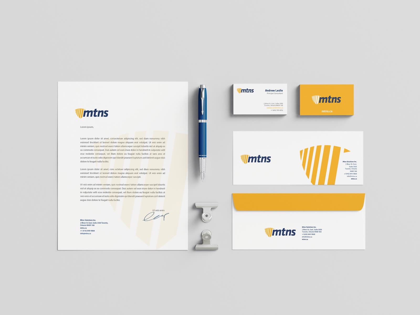 MTNS stationery: letterhead, business cards in white and amber, and envelopes